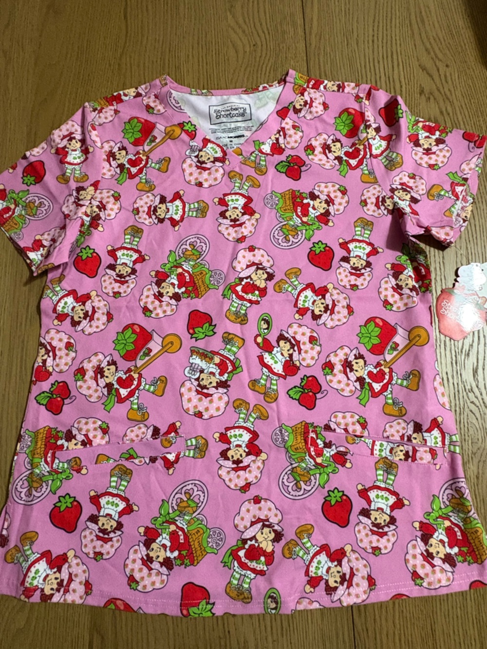 Pink Strawberry Character Print Scrub Top by Strawberry Shortcake